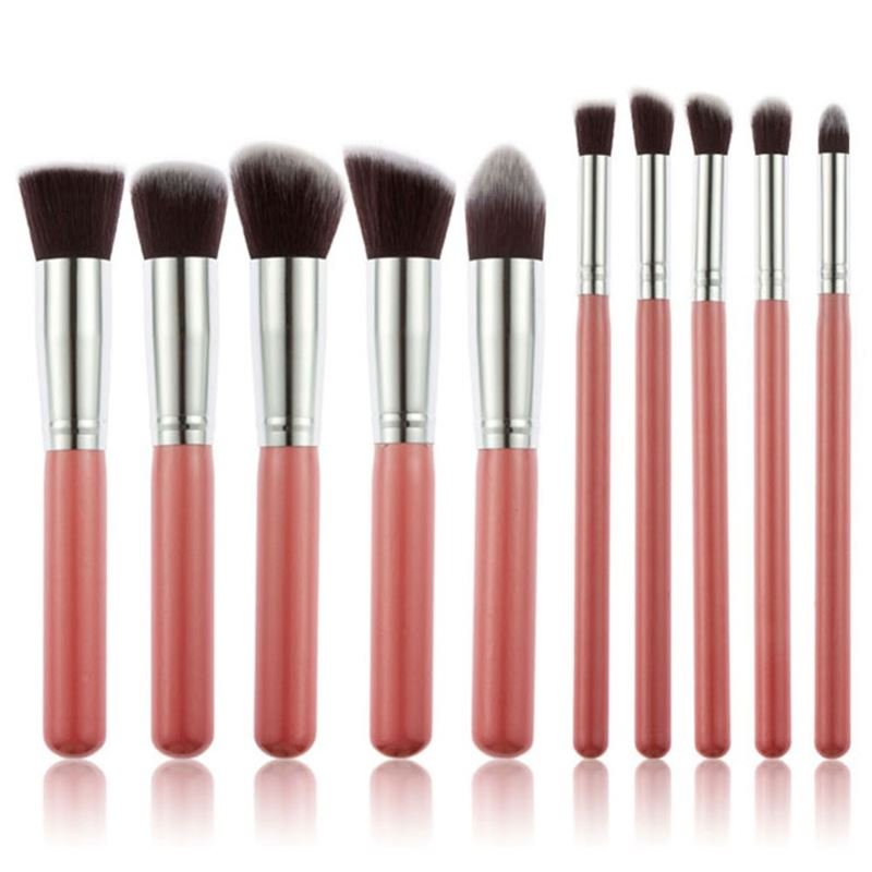 Technique PRO | Makeup børster Rose: Et sæt med 10 professionelle rosa og sølv makeup børster fra Technique PRO, inklusiv præcisions- og kabuki børster i forskellige former og størrelser, elegant arrangeret på en hvid baggrund.