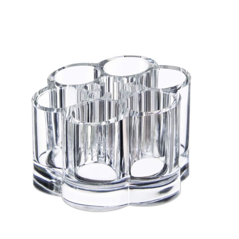 UNIQ Blomster Makeup Akryl Organizer | U301 fra UNIQ har seks klare cylindriske rum i et cirkulært design, ideelt som opbevaringsbeholder til kuglepenne, børster eller som en smart læbestiftholder.