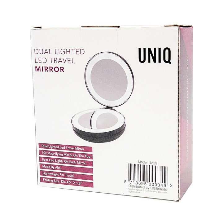 En sort UNIQ-æske til UNIQ Kompakt Dobbelt Rejsespejl med LED og x10 Forstørrelse viser det åbne runde spejl. Teksten fremhæver LED-lys, x10-forstørrelse, bærbart design og letvægts-ABS-materiale.