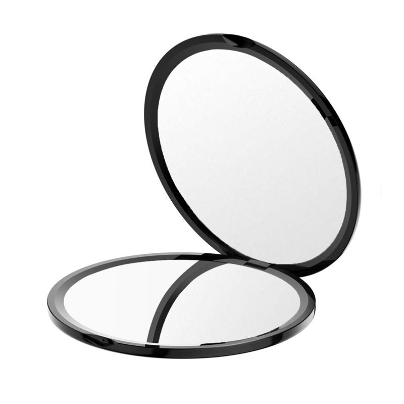 UNIQ Kompakt Dobbeltsidet Spejl med x10 Forstørrelse i sort er åbent og afslører dobbelt spejl, inkl. x10 forstørrelse. Det elegante, moderne design er ideelt til rejser eller daglig brug.