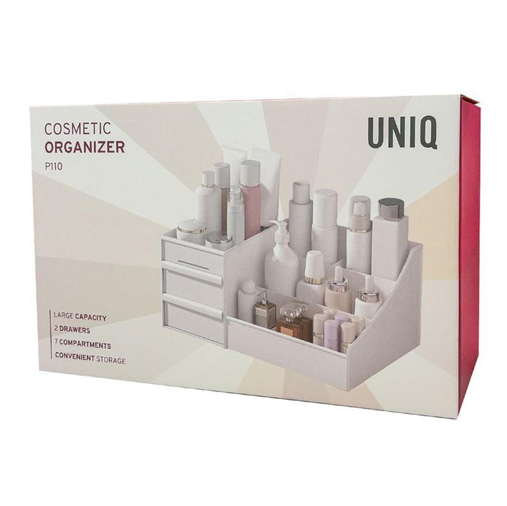 En hvid æske mærket UNIQ Kosmetik Organizer | P110 | Hvid viser et foto af en makeup-organizer med flere rum fra UNIQ og fremhæver funktioner som stor kapacitet, 2 skuffer, 7 rum og praktisk opbevaring.