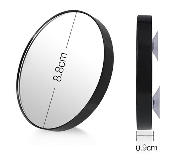 UNIQ Makeup spejl | Inklusiv x10 Forstørrelse og Sugekop | Sort er et rundt, sort indrammet spejl (8,8 cm i diameter, 0,9 cm tykt) fra UNIQ med sugekopper og x10-forstørrelse til detaljeret refleksion, vist forfra og fra siden.