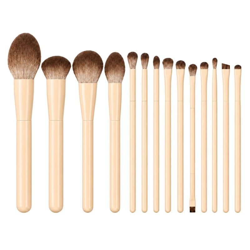 Technique PRO Vanilla Makeupbørste Sæt består af fjorten makeupbørster med beige skafter og brune børstehår, der er anbragt i en række fra den største til den mindste – perfekt til at løfte din makeuprutine til et nyt niveau.