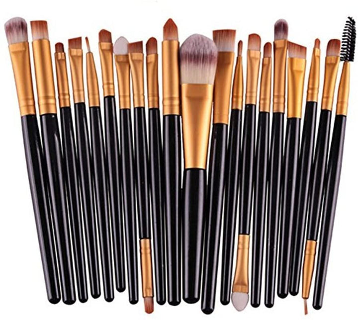Et sæt Technique PRO Professionelle Makeupbørster, 20 stk. i guld/sort, med sorte skafter og guldfarvede hylster, opstillet lodret på række. Dette professionelle makeupsæt indeholder børster i forskellige former og størrelser, der er perfekte til præcis påføring af makeup.